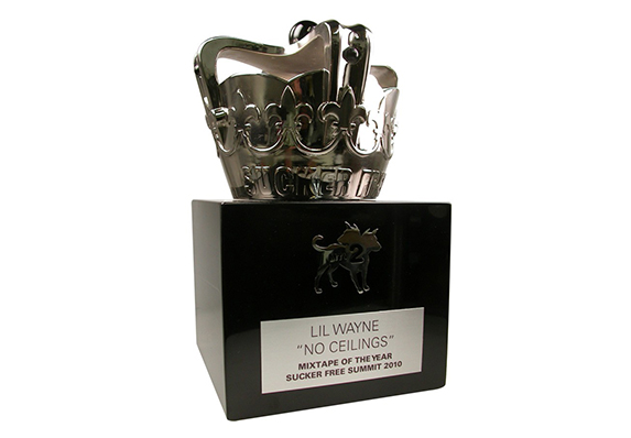 custom silver crown trophy on piano finished ebony wood base with custom metal logo cutout televised award
